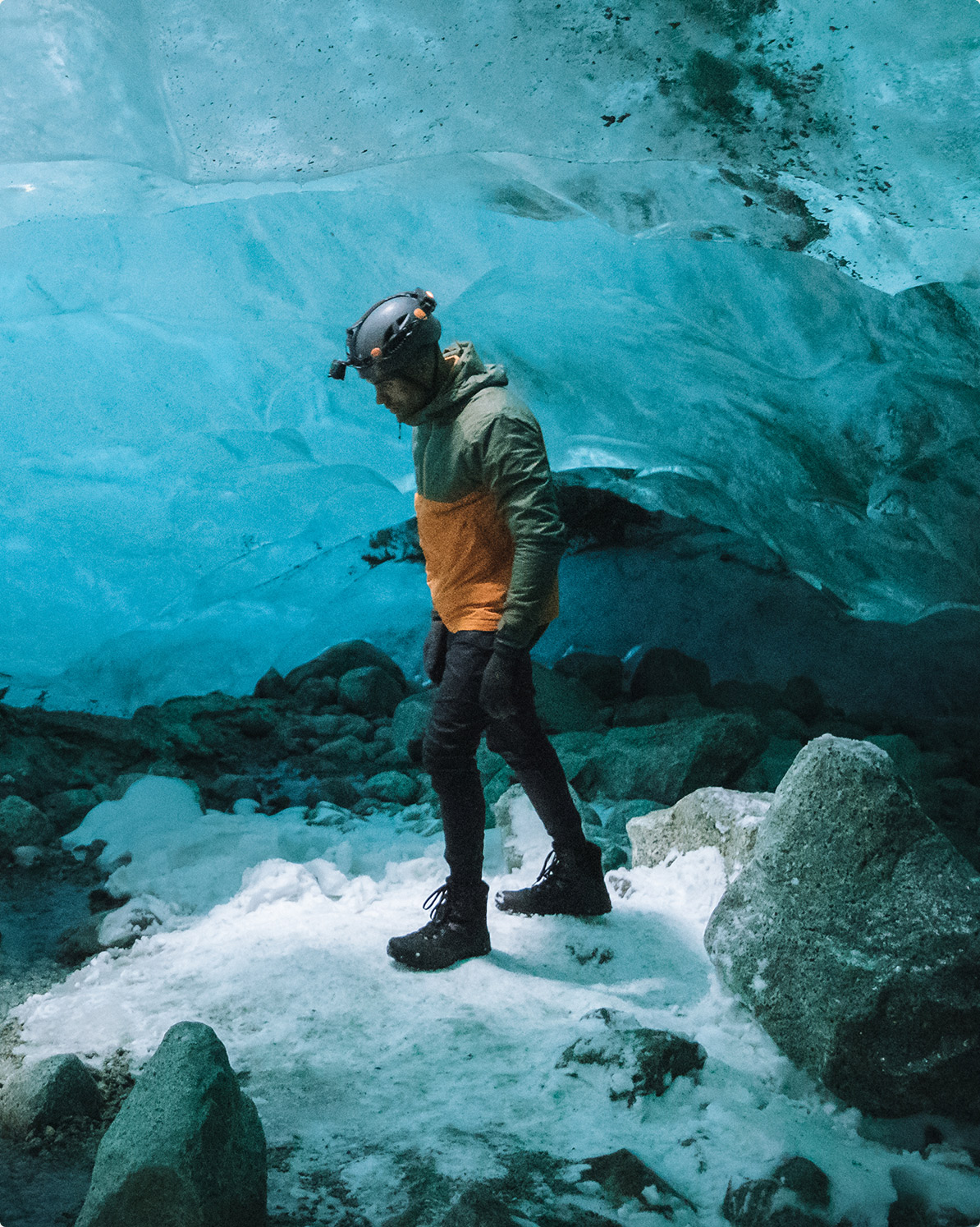 Man in the ice cave in Winter Merrell Shoes.