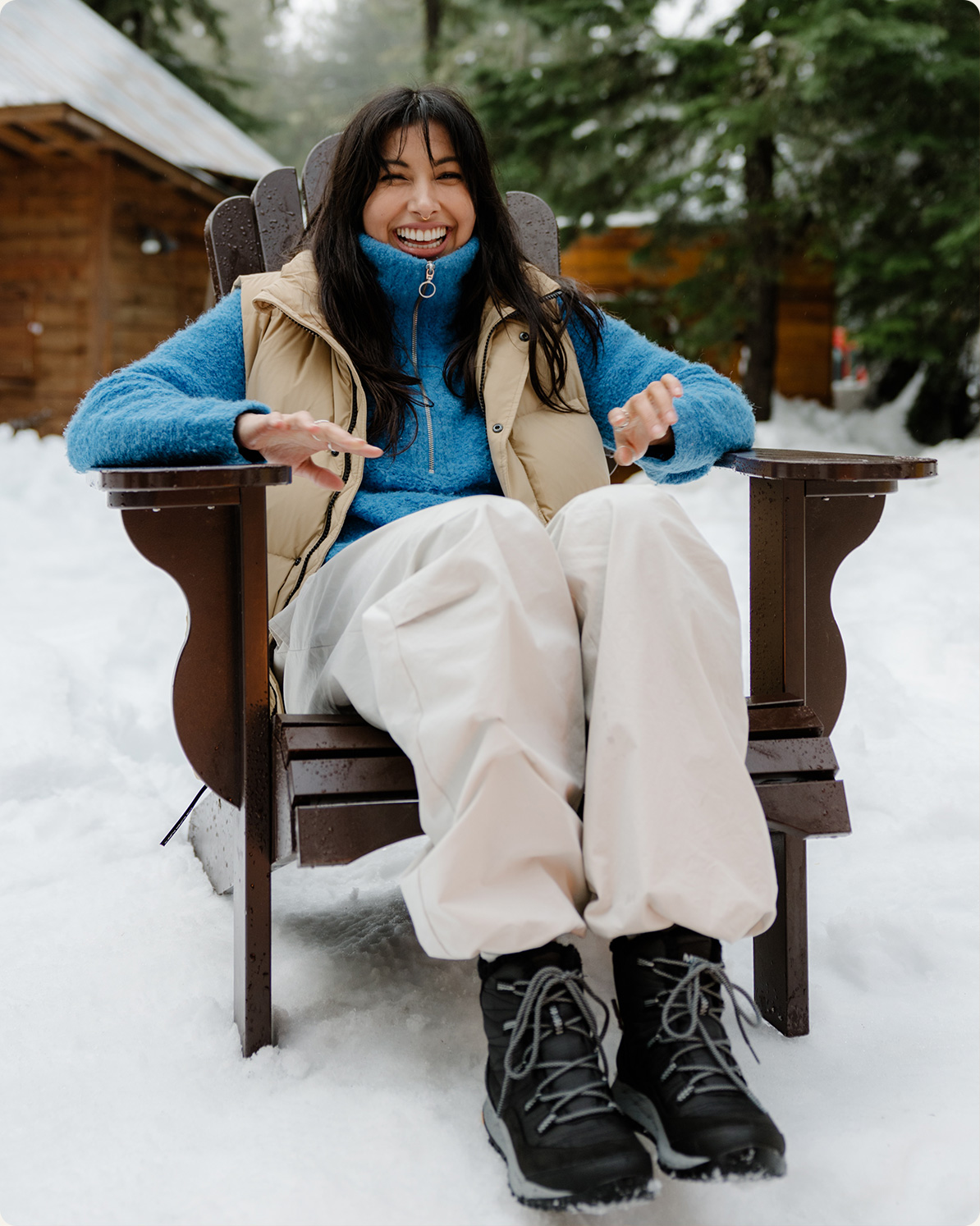 Person sitting outside in Merrell boots.