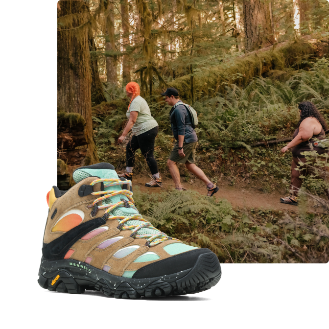 Three people hiking while wearing Merrell's