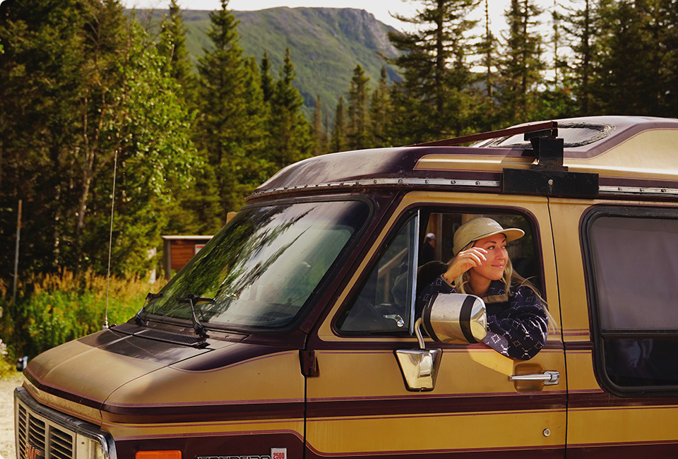 Audrey Normandeau sitting in the car somewhere in the wood.