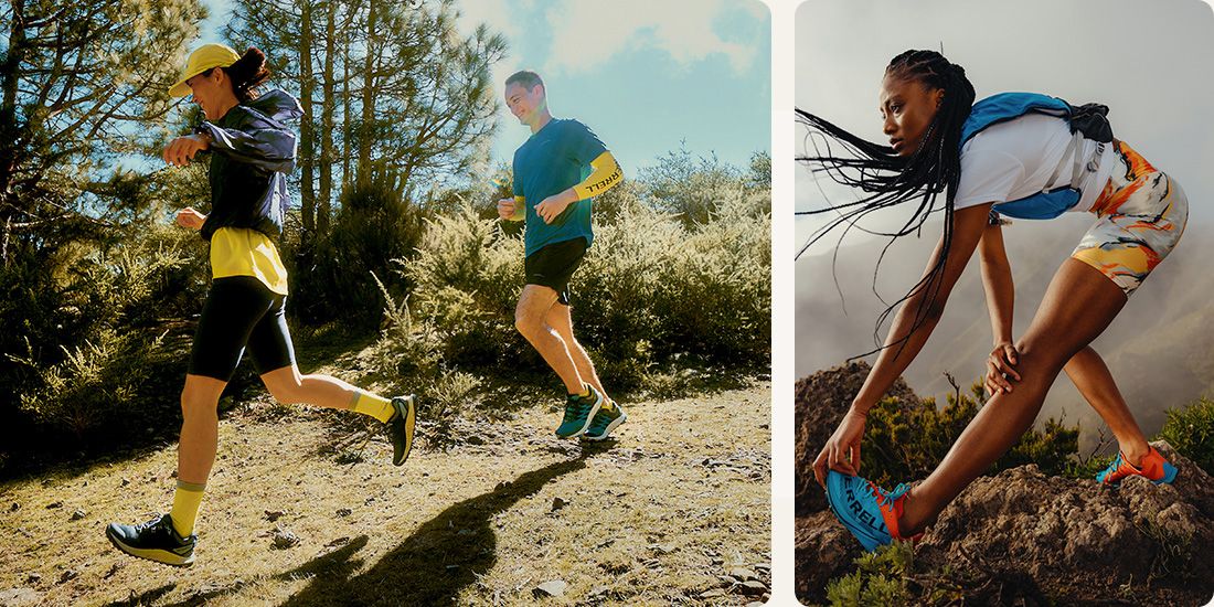 A couple of people running on a trail and a person stretching on a rock.