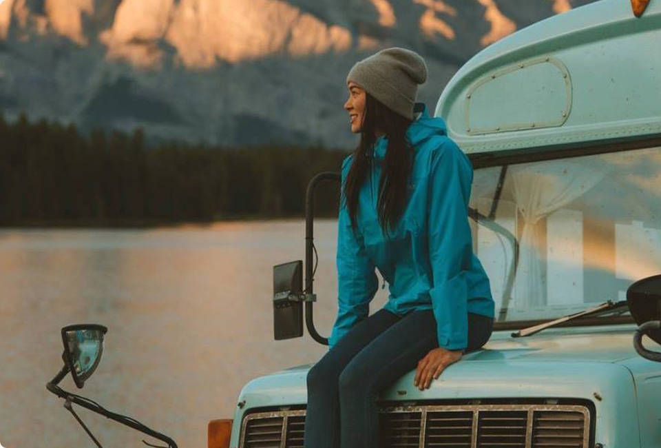 Kieren Britton sitting in front of an lake.