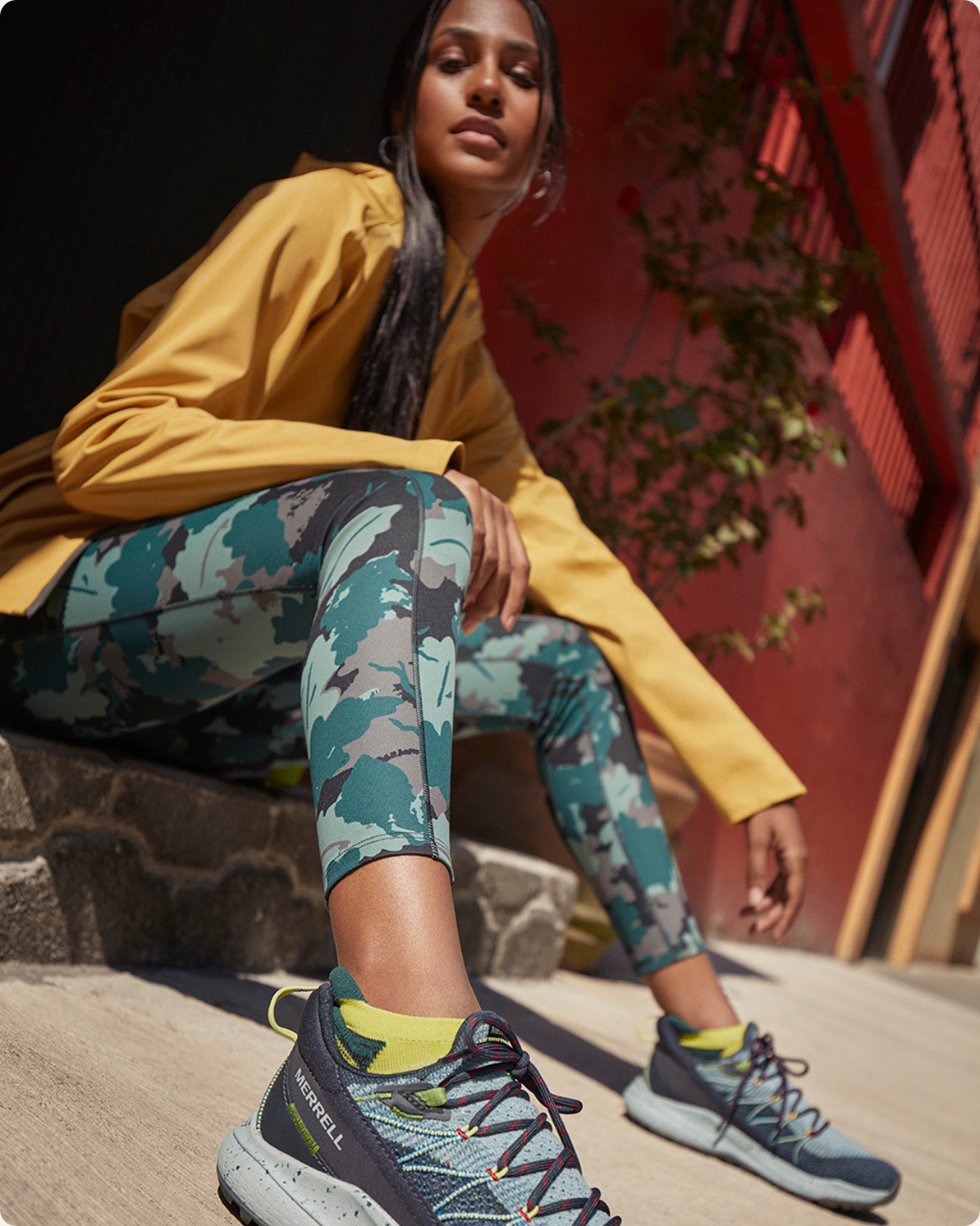 Person sitting in Merrel Shoes.