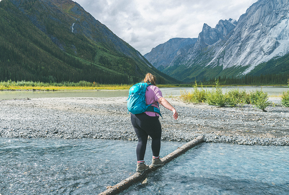 Kaila Walton crossing the river.