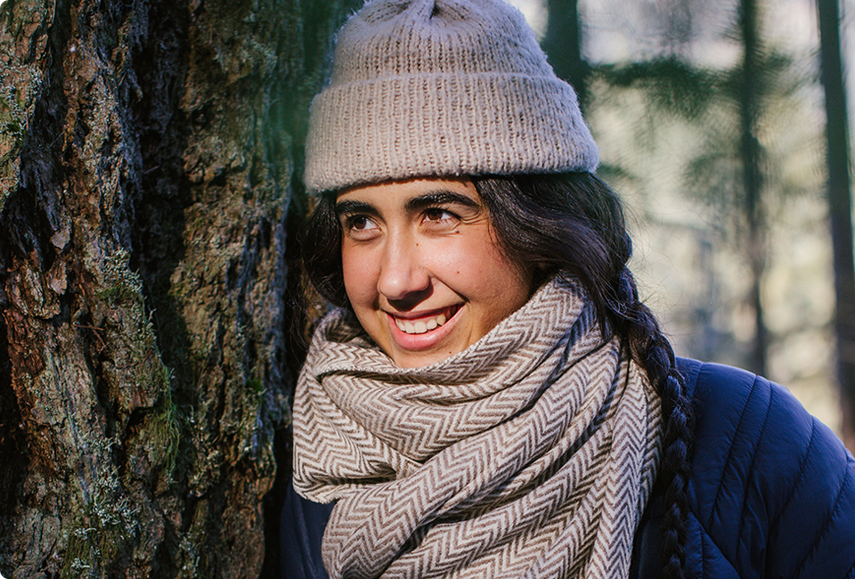 Asalah Youssef wearing a hat and scarf.
