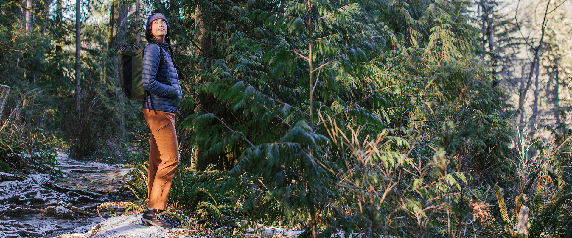 Asalah Youssef standing in the woods.