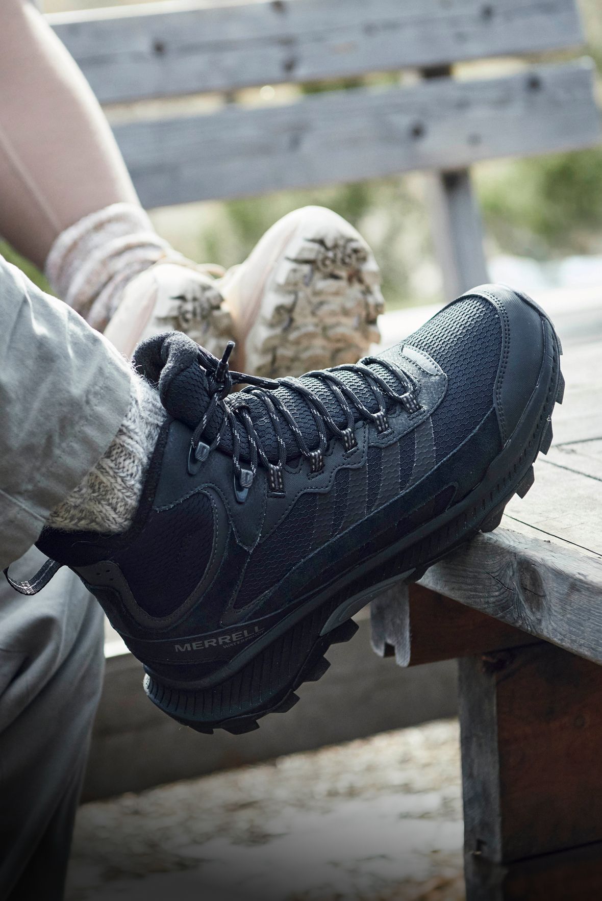 Man in woods wearing Merrell hiking boots