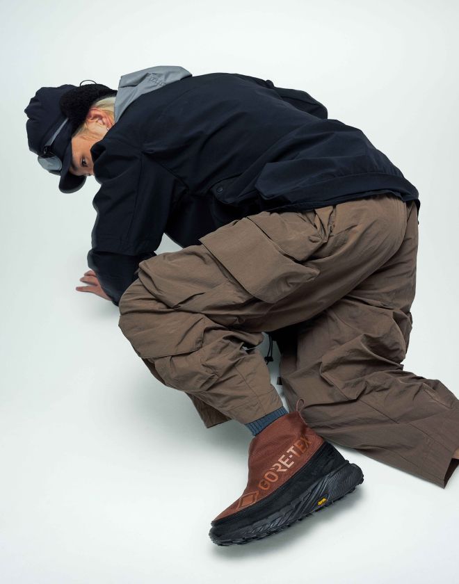a person tying a shoelace