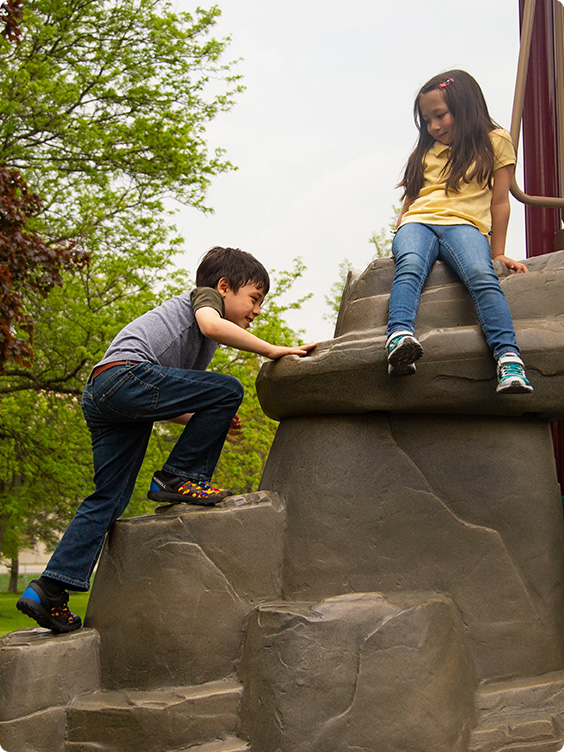 Kids climbing in Merrell shoes.