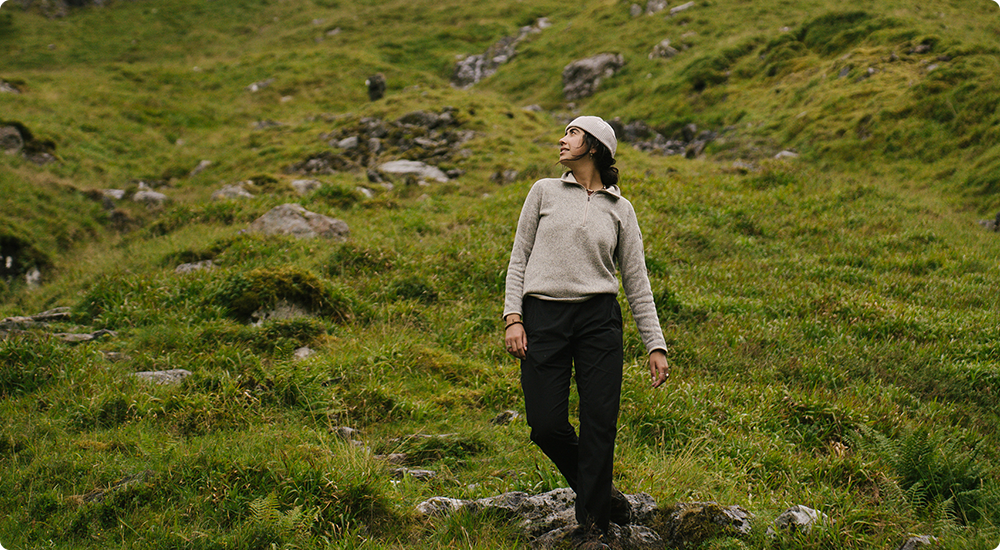 Asalah Youssef standing on a grassy hill.