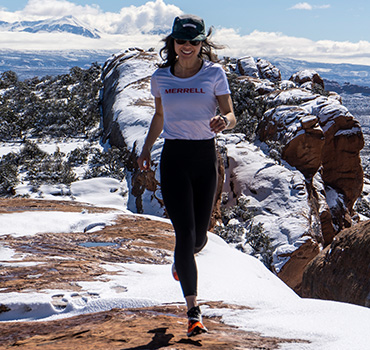 Emilie Mann running in the mountains.