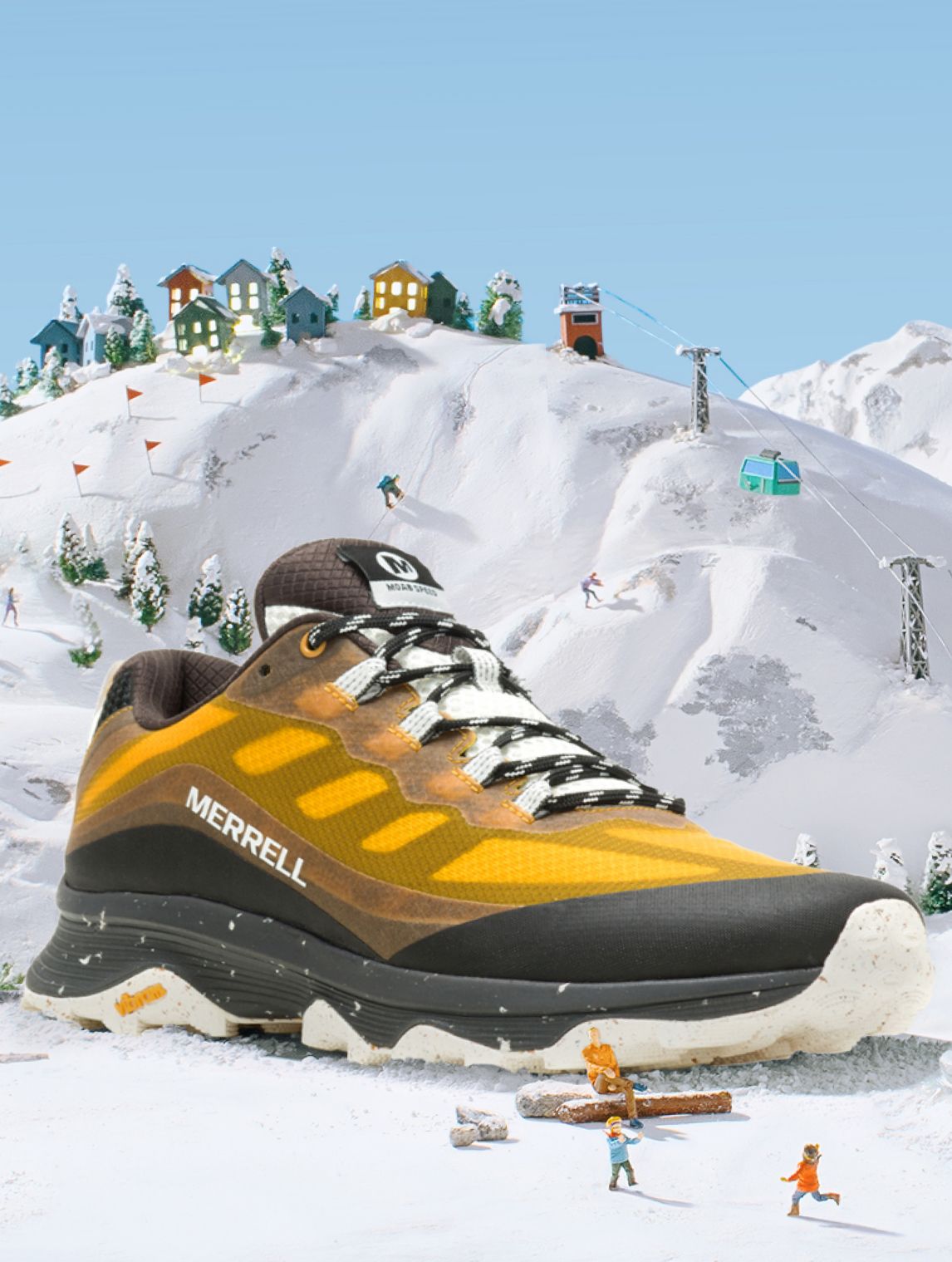 A yellow and black Merrell shoe on a snowy mountain.