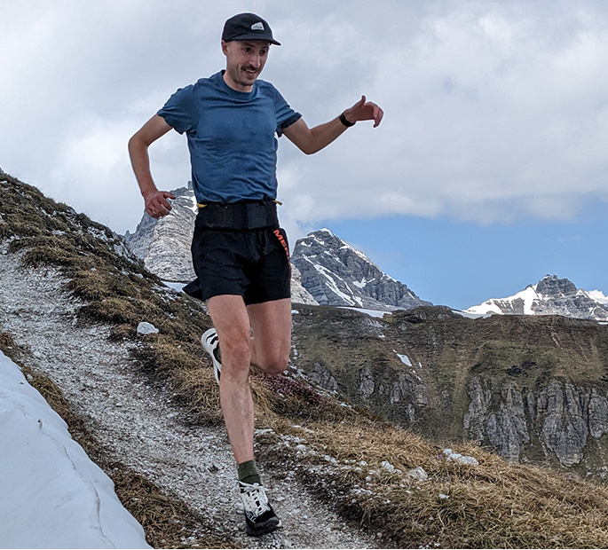 Brandon Miller running on a mountain.