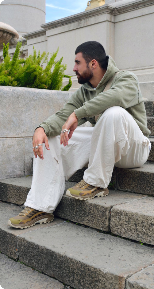 A person wearing Merrell footwear
