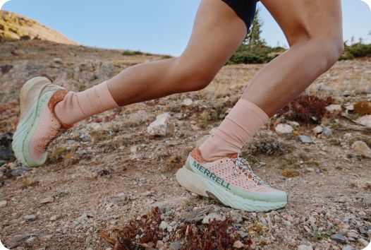 a person running on a rocky terrain