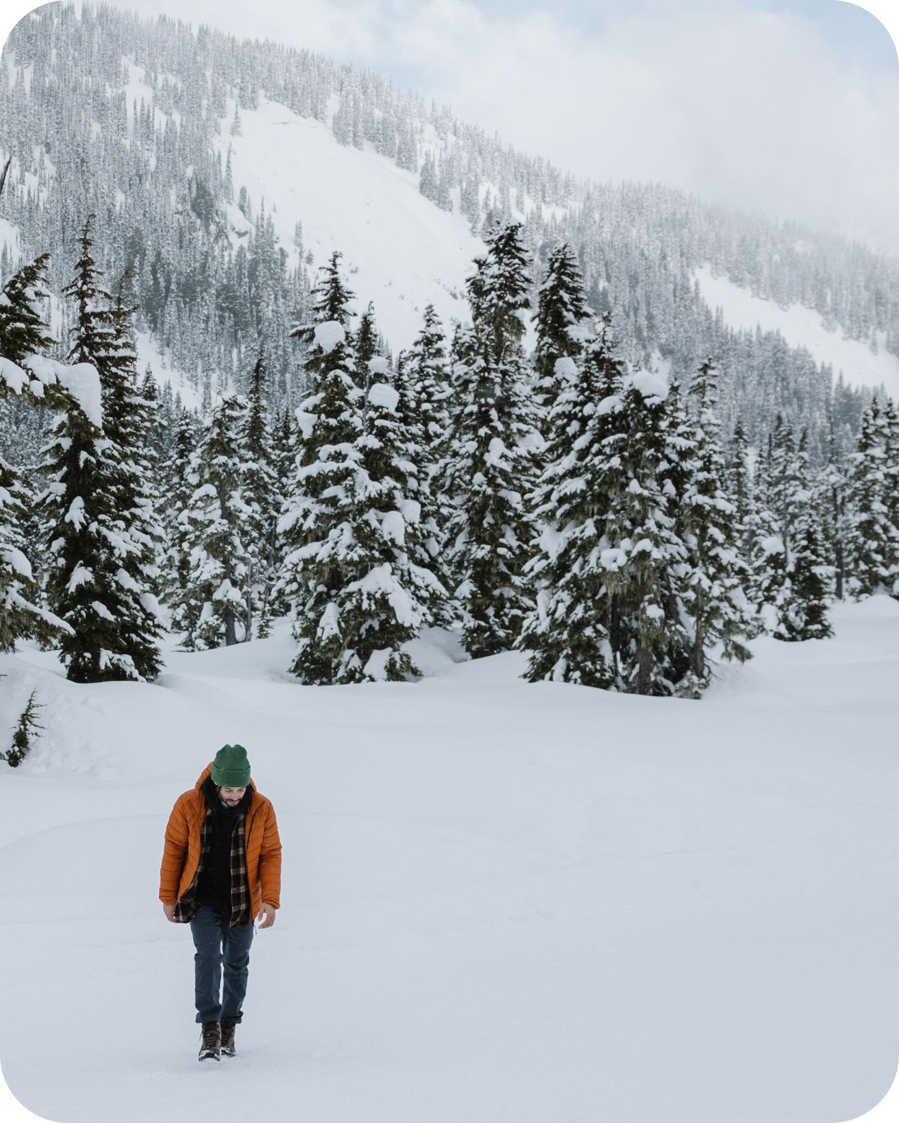 Person wearing boots walking in snowy landscape