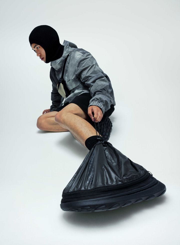 Person laying down with the shoes on.