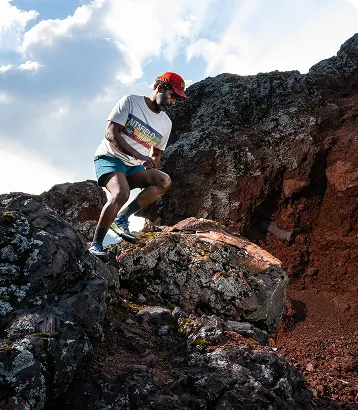 Person hiking on rocky terrain outdoors