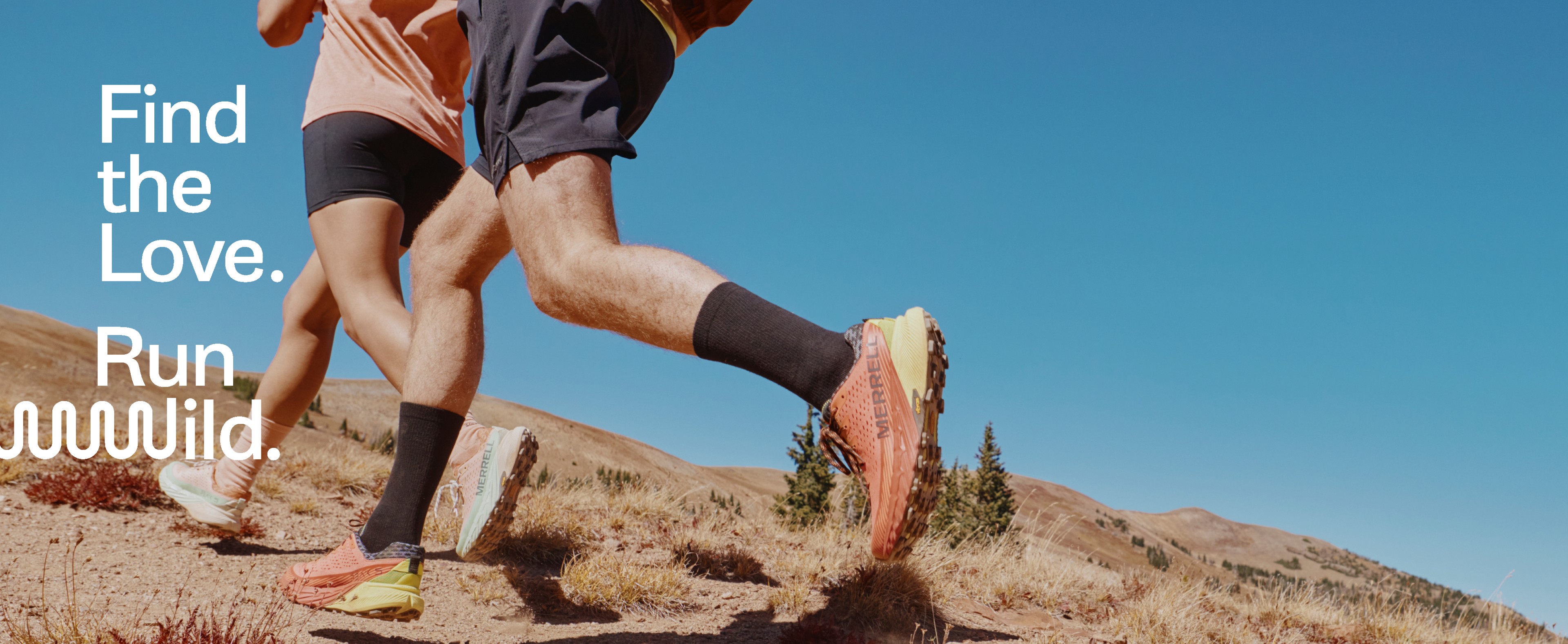 Person wearing boots running on mountain landscape