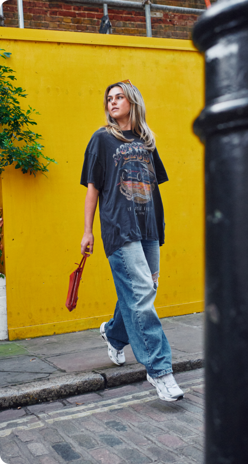 A person wearing Merrell footwear