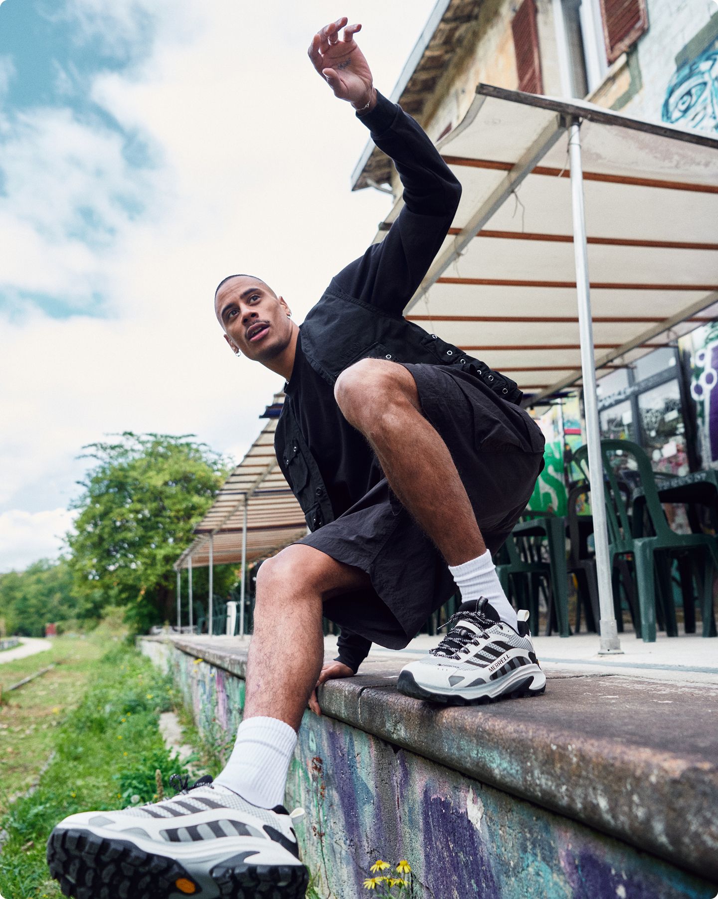 Adrien Truong lifetsyle image wearing Merrell shoes in London.