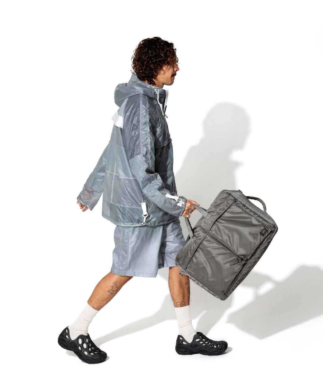 a man walking with a bag