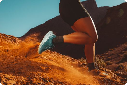 a person running on a rocky terrain
