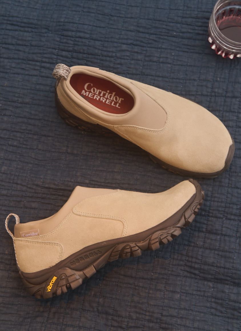 Lifestyle image of 2 people relaxing outside in Merrell gear.f