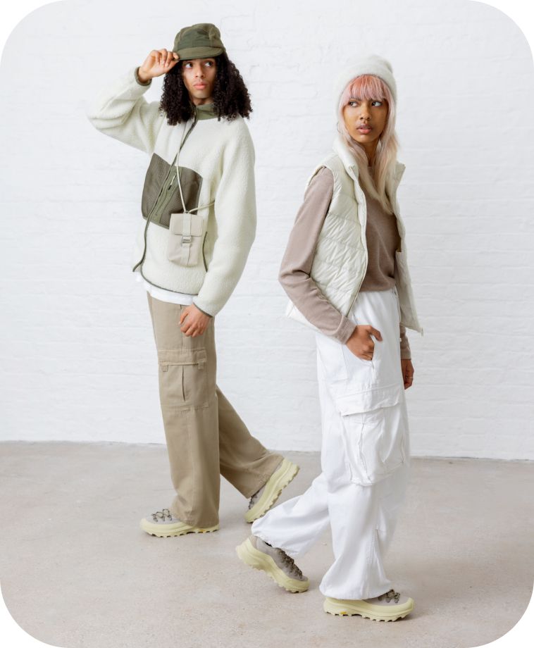 two medels in bucket hats wearing creem and tan ontario speed lace shoes