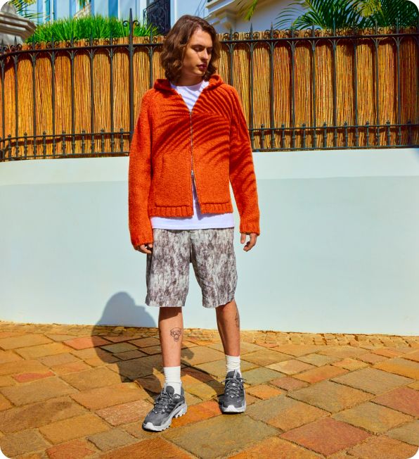 a man standing on a brick surface