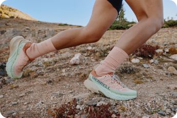 a person running on a rocky terrain