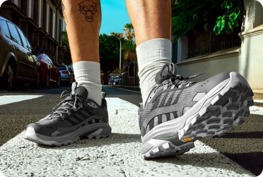 a person's feet in hiking shoes