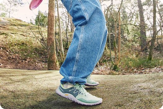 a person wearing jeans and sneakers