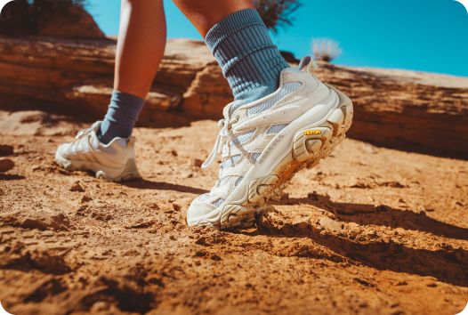 a person's feet in a pair of shoes