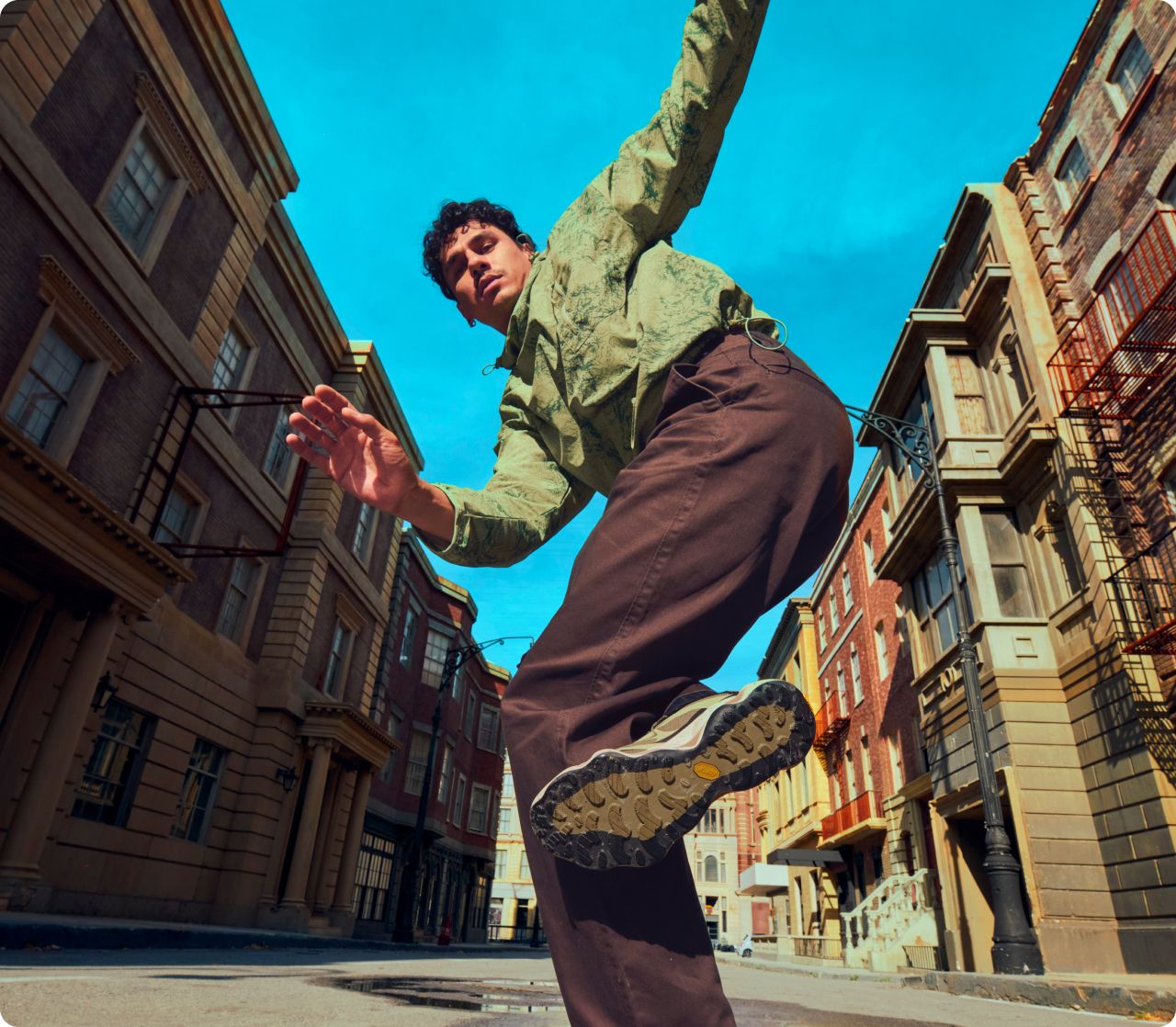 Person dancing in the street wearing Merrell gear.