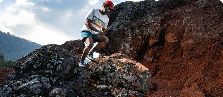 Person hiking on rocky terrain outdoors