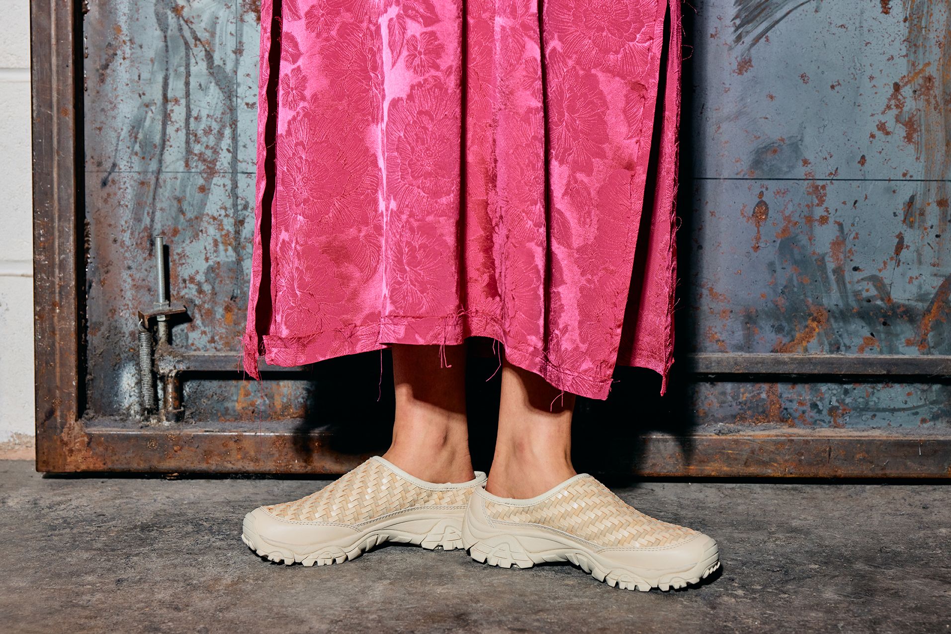 Two people wearing Merrell Moab Slide Woven shoes.