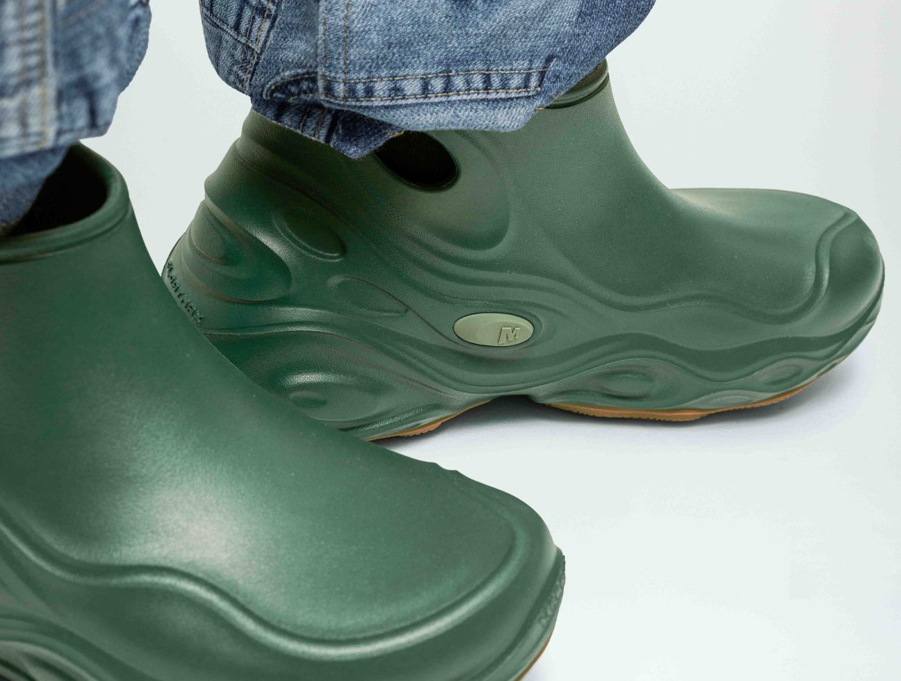a pair of green rubber boots