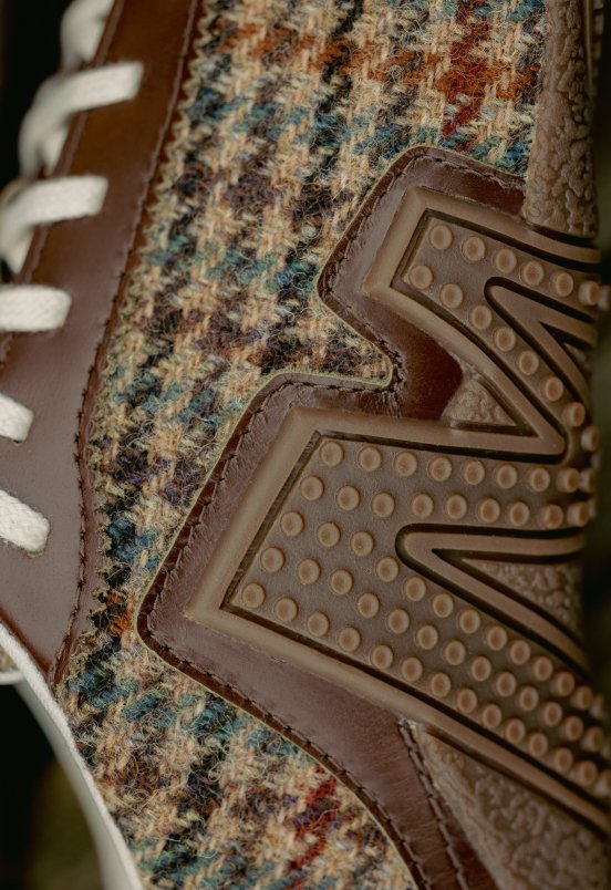 Close-up of the Merrell logo on a Harris Tweed upper.