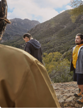 Group of people standing in a mountain range