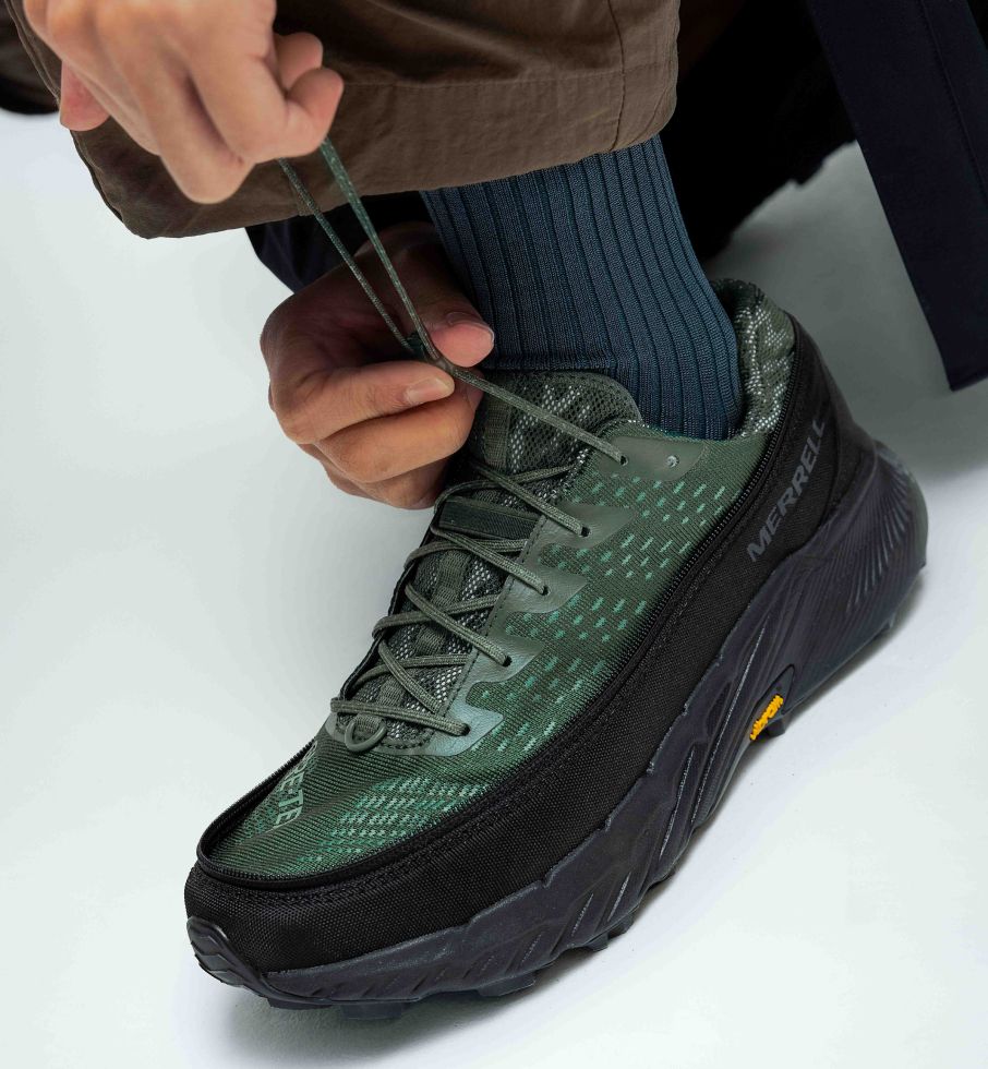 a person tying a shoelace