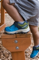 Kids's new arrivals shoes in a field.'