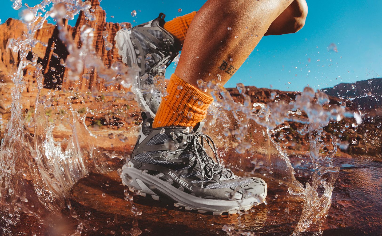 A person running through a puddle of water.