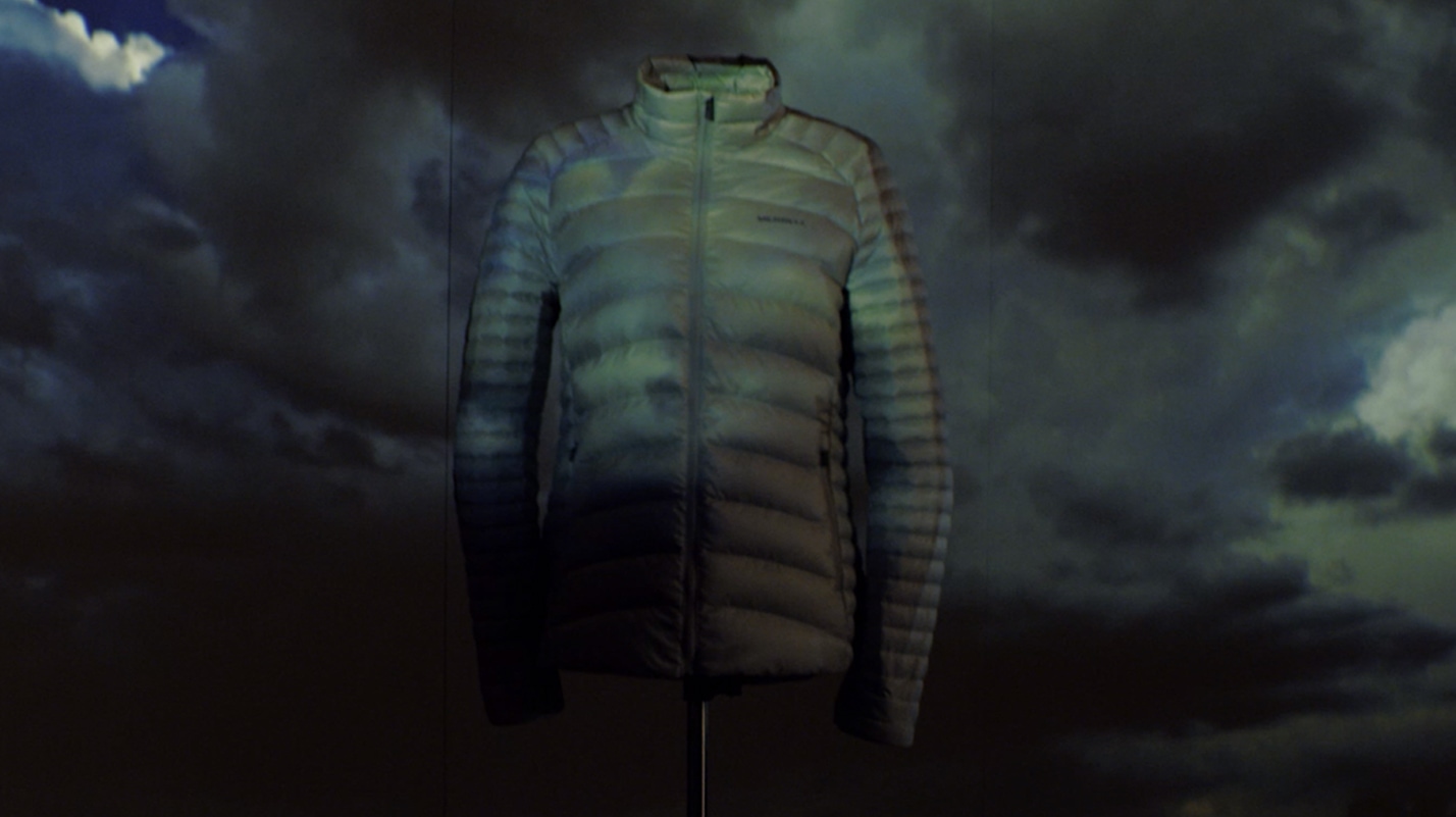 Ridgevent jacket with dark clouds behind it