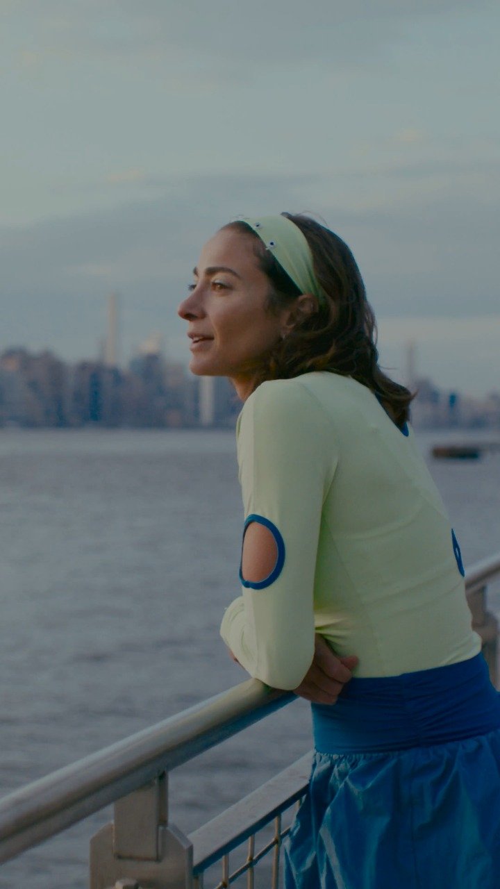 Alexi Pappas standing along the New York City waterfront