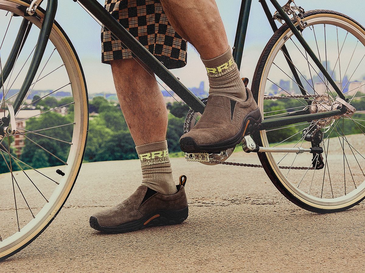 Person biking in Merrell Jungle Moc shoes