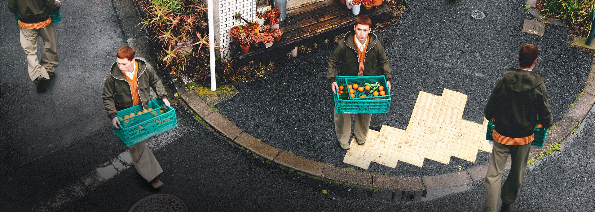 A person wearing Merrell barefoot shoes standing in a market.