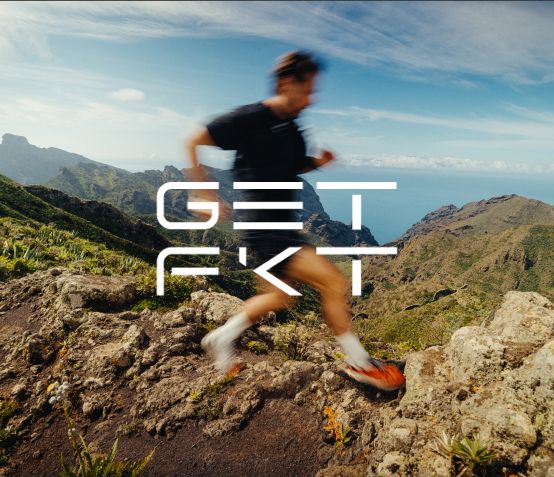 Blurred image of a person running in the mountains.