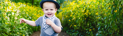 Little boy happily hiking down the trail.