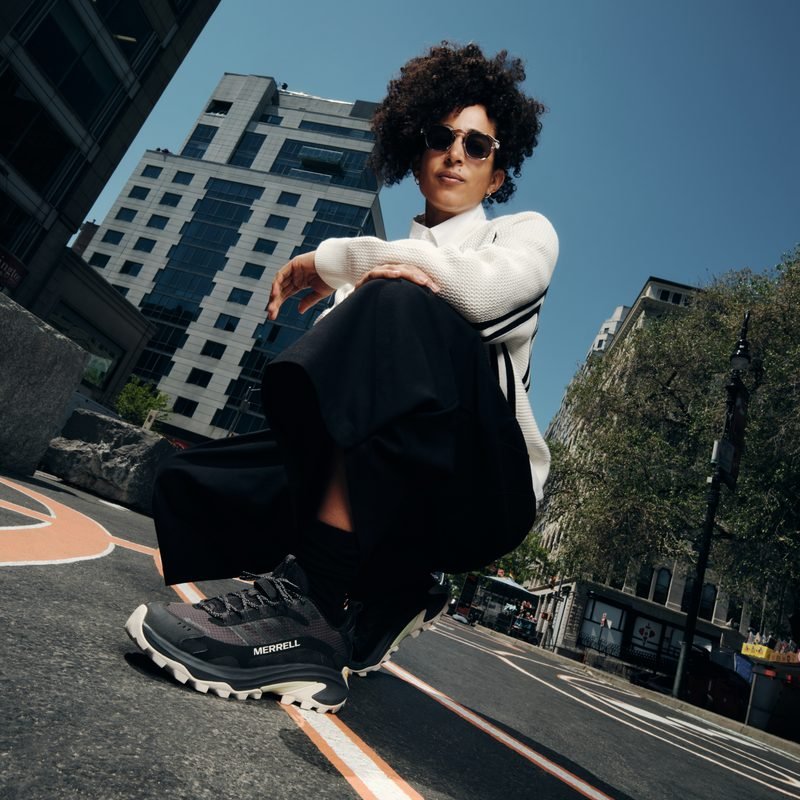 Shantell Martin drawing a line mural on a New York City wall